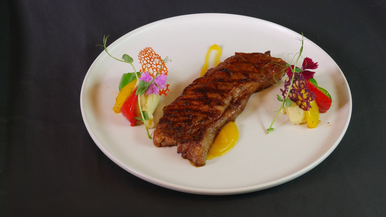 Australian Wagyu steak served with mashed potato and fresh vegetables at Lambogrill