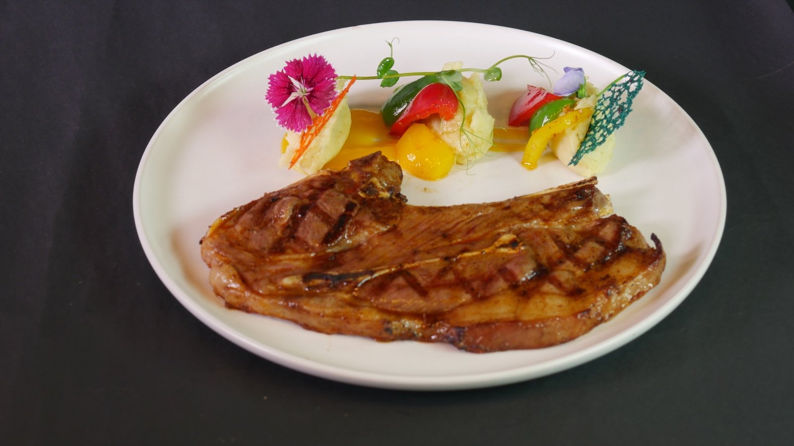 Lambo lamb shoulder steak served with mashed potato and fresh vegetables